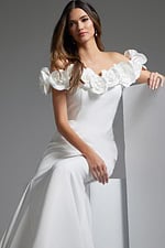 Model wearing Jovani JB40594 white mermaid gown seated view