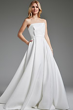 Model wearing Jovani JB40599 elegant A-line white gown with strapless neckline, front view.
