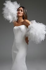 Model wearing Jovani JB40601 white gown, showcasing off-the-shoulder tulle sleeves.