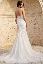 Back view of beaded mermaid wedding dress with floral appliques and sheer straps