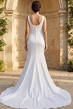 Long train bridal gown with structured corset back and button details