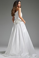 Model wearing Jovani JB40784 white dress from the back, showcasing floral details.