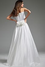 Model wearing Jovani JB40784 white gown, back view with floral accents.