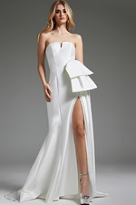 Model wearing Jovani JB40791 white strapless gown with high slit.