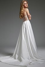 model wearing Jovani JB40825 white gown with structured corset back detail