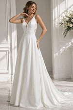 A-line design with romantic floral appliqués and elegant cathedral train.