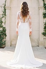 ivory gown from the back, showcasing lace details and train.