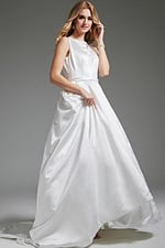 Model in JB42319 ivory gown, front view holding the dress's flowing skirt