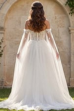 Romantic lace bridal gown with draped tulle sleeves and flowing skirt