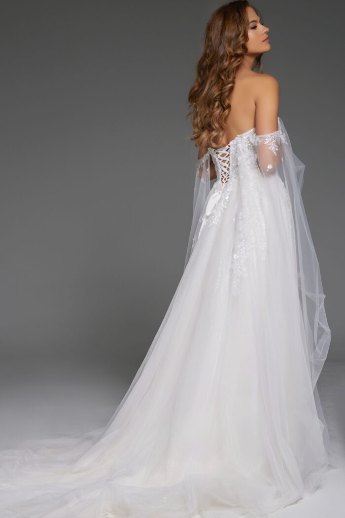Back view of model wearing Jovani JB42481, highlighting lace-up back and train.