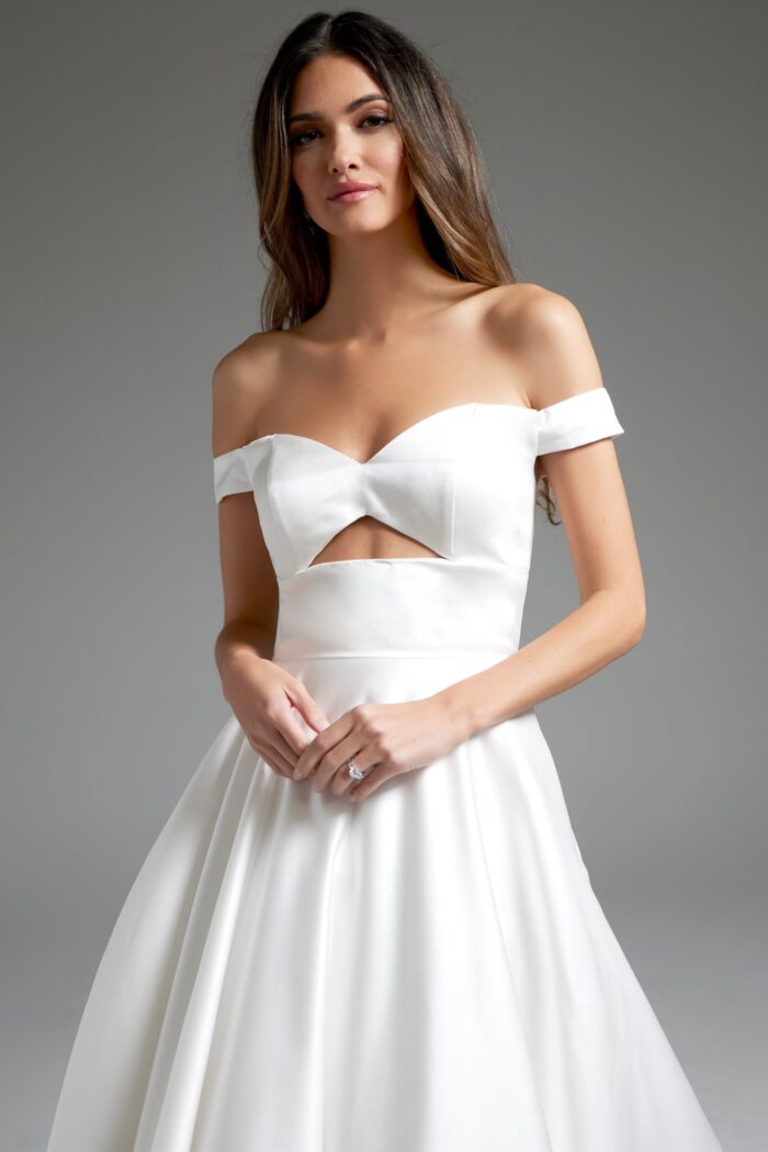 Close-up of model wearing Jovani JB42626 with off-the-shoulder neckline and cutout.