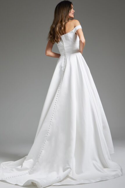 Back view of model in Jovani JB42626 showing the buttoned detail on white dress.