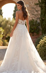 Classic strapless wedding gown with delicate lace detailing and soft tulle layers