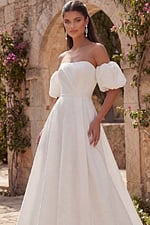 Off shoulder bridal gown with puff sleeves and full skirt