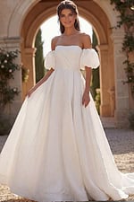 Off shoulder wedding gown with puff sleeves and flowing train