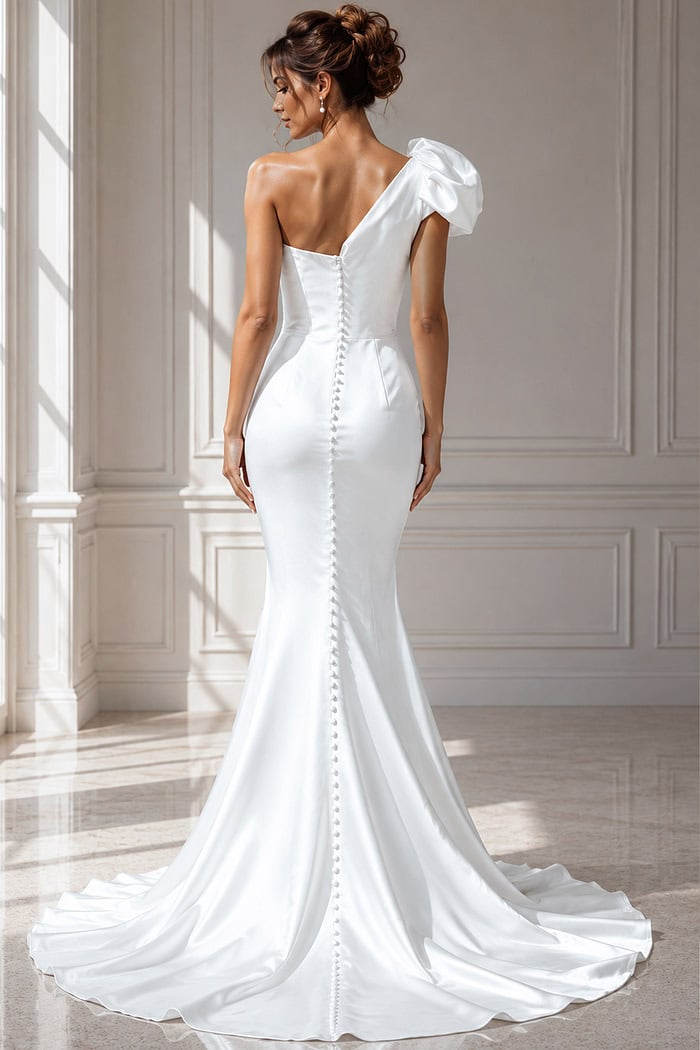Sophisticated bridal gown crafted in smooth ivory satin, showcasing a puffed shoulder accent