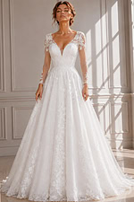 Romantic Bridal Gown Featuring a Deep V-Neckline, Sheer Sleeves, and Flowing Skirt