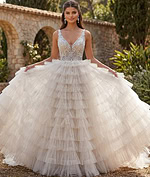 Designer layered ruffle tulle gown with deep V neckline