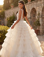 Dreamy ruffle tiered gown with fitted lace bodice and sweeping train