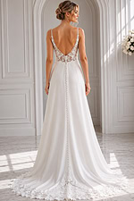Elegant crepe A-line gown featuring delicate spaghetti straps, a sculpted sweetheart neckline, and subtle lace side accents.