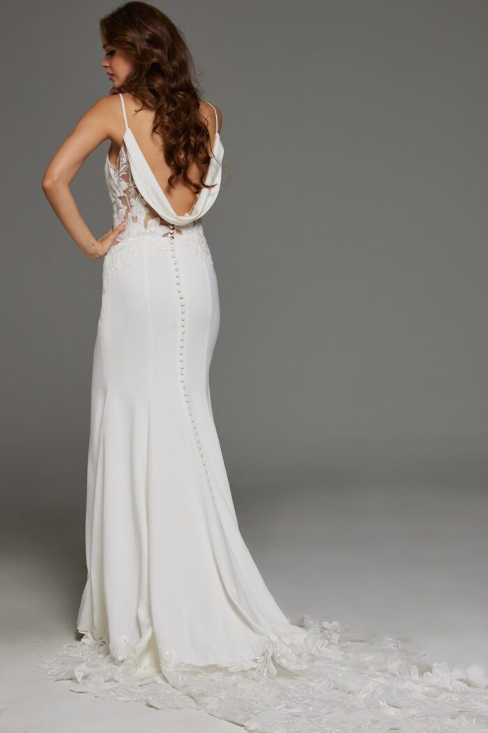 Model displaying the full length back of Jovani JB43322 gown with lace detailing and a soft train.