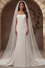 Fitted wedding dress with floral waist appliqué and flowing train