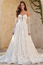 Lace off shoulder bridal gown with floral lace bodice, long sheer sleeves, and full A line skirt.