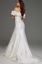 Model wearing Jovani JB43896 ivory gown with button detailing and mermaid silhouette from the back view.