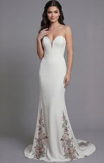 Feminine strapless gown with floral embroidered skirt and sleek silhouette