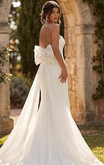 Timeless ivory fitted gown with elegant silhouette and oversized bow accent
