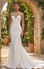 Sophisticated ivory mermaid dress with clean lines and statement bow detail