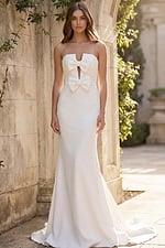 Front view of strapless bridal dress with double bow bodice and sleek silhouette
