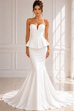 Elegant fit-and-flare wedding dress with clean lines, peplum detail, and chapel train.