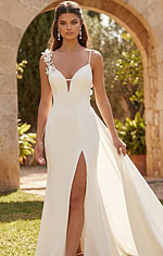 Chic bridal gown with sculpted silhouette and elegant floral shoulder detail