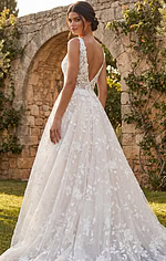 Feminine lace gown with embroidered floral pattern and classic A line silhouette