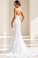 white 3D floral lace strapless fitted mermaid wedding dress with sweetheart neckline and sheer corset bodice, front view, Jovani Bridal style JB99063