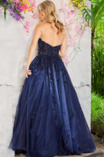 Back view of Jovani 00915 navy gown with a full skirt and intricate lace details.