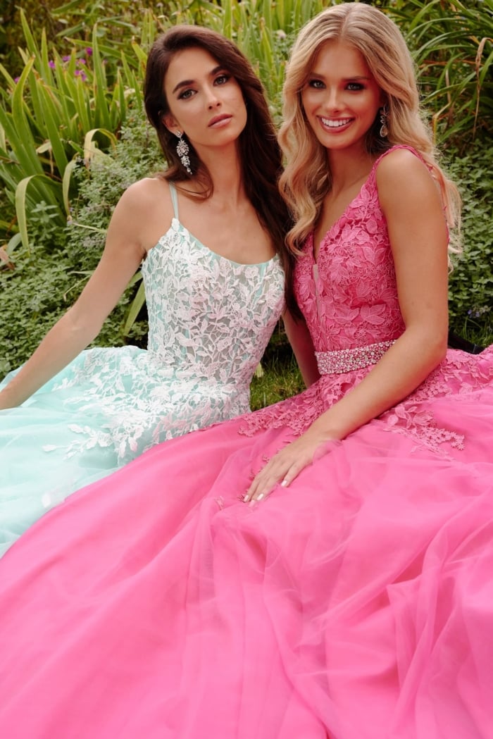 Two models wearing Jovani 06644 evening gowns in different colors with floral embroidery.