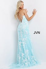 Model showcasing the back of Jovani 06660 aqua dress with elegant lace-up.
