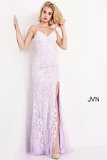 Model posing in Jovani 06660 lilac dress with floral embroidery and slit.