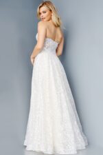 Model wearing Jovani 08417 ivory A-line dress back view