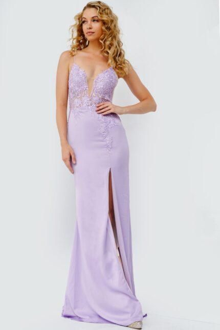 Model wearing Jovani 23124 lilac gown with lace embroidery and high slit.