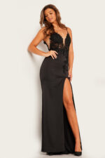 Model wearing Jovani 23124 black gown with elegant lace and high slit.