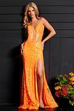 Model wearing Jovani 23216 orange dress, front view against a dark background.