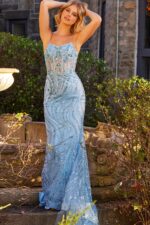 Model wearing Jovani 23250 blue mermaid gown with sequined bodice.