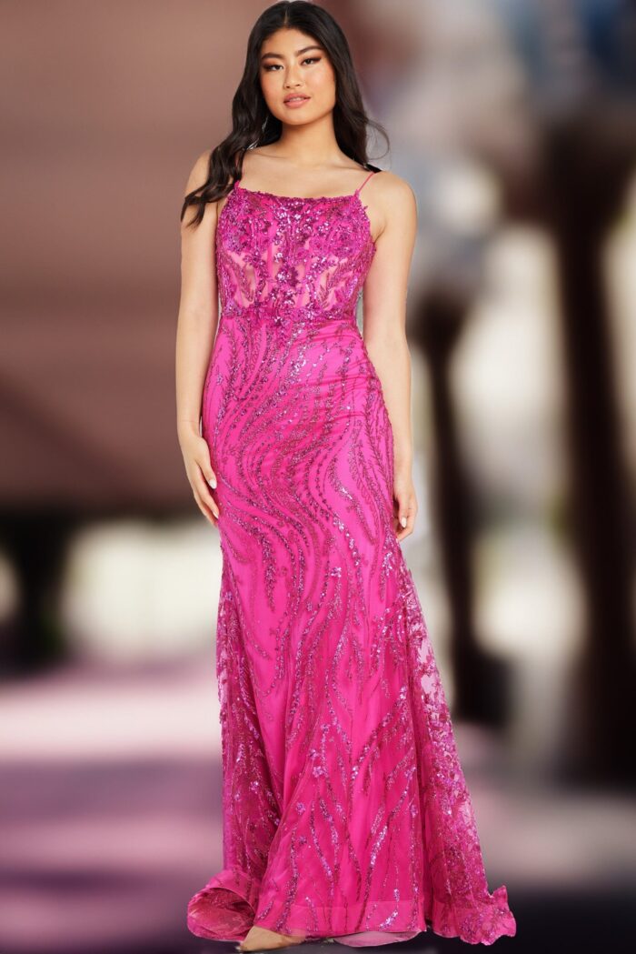 Model in Jovani 23250 fuchsia gown with intricate sequin details.