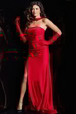 Model in Jovani 23985 red gown, showcasing high slit and elegant gloves