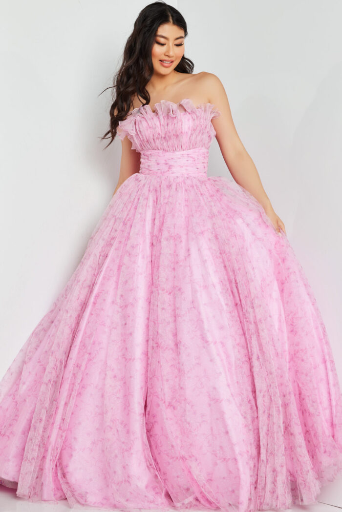 Model wearing Jovani 26209 pink gown with ruffled off-the-shoulder neckline.