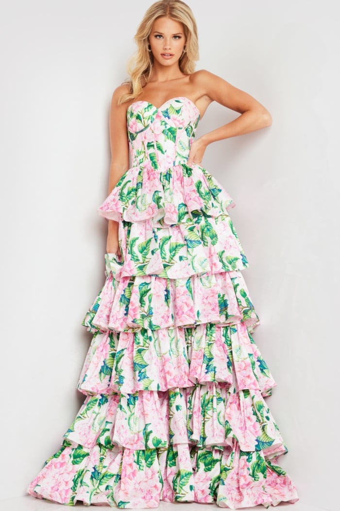 Model in Jovani 37058 dress, front view with floral design and tiered ruffles