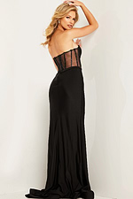Frontal view of the model wearing Jovani 37527 black dress with a sheer corset and high slit.